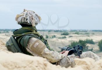 soldier in desert uniform at rest