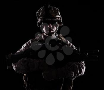 US marine with the rifle on black background