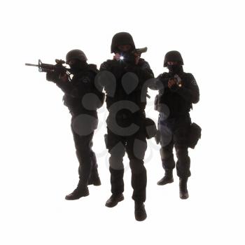 Silhouettes of special weapons and tactics (SWAT) team in action