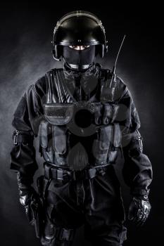 Spec ops soldier in uniform on black background
