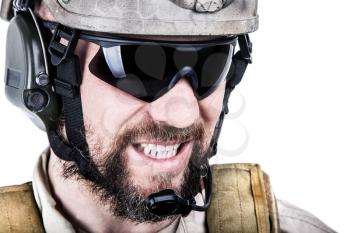 Close up image of bearded special warfare operator in protective helmet