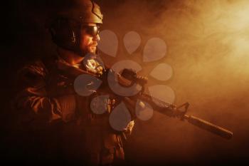 Bearded special forces soldier in the smoke