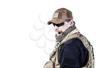 Studio shot of private military contractor PMC smoking a cigar