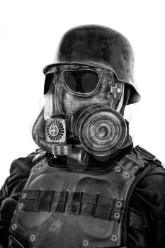 Futuristic nazi soldier gas mask and steel helmet with schmeisser handgun isolated on white studio shot closeup portrait