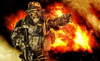 United States Commando half length studio shot. Mouth opened, soldier yelling, emitting intiminate formidable frightening scream pointing finger target and giving attack direction to subordinates