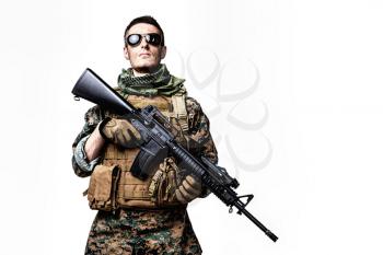 Studio shot of United States Marine with rifle weapons in uniforms. Military equipment, army helmet, combat boots, tactical gloves. Isolated on white, weapons, army, patriotism concept