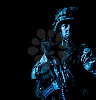 US Marine Corps Soldier under cover of darkness. Dark gloomy night