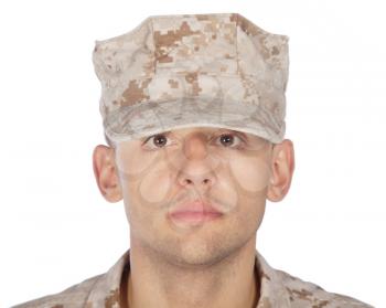 Shoulder studio portrait of smiling United States army soldier, marine infantry or military contractor in camouflage combat uniform and patrol cap