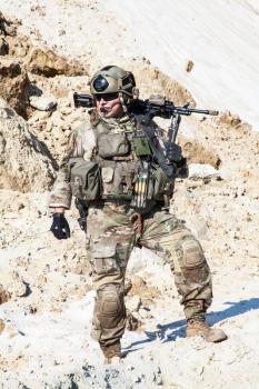 United States Army ranger in the mountains with machine gun