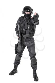 Spec ops police officer SWAT in black uniform studio shot