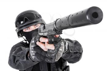Spec ops police officer SWAT in black uniform with pistol studio 