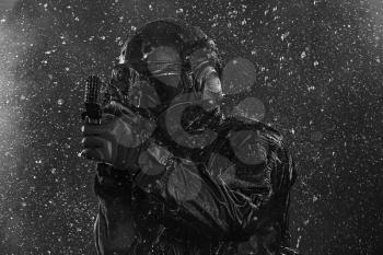 Spec ops police officer SWAT in the rain