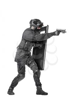 Studio shot of swat police special forces aiming criminals with pistol standing hiding behind ballistic shield. Isolated on white