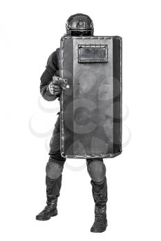 Studio shot of swat police special forces aiming criminals with pistol standing hiding behind ballistic shield. Isolated on white full body portait