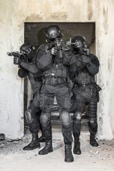 Team squad of swat police special forces in action. Full body