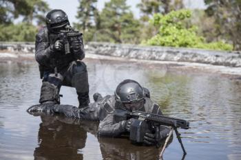 Spec ops police officers SWAT in action in the water