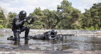 Spec ops police officers SWAT in action in the water