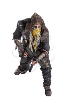 Nuclear post apocalypse life after doomsday concept. Grimy survivor with homemade weapons. Studio high angle portrait on white background
