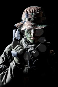 Jagdkommando soldier Austrian special forces with pistol on dark background 