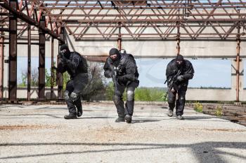 Special forces operators in black uniform in action