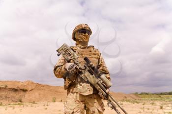 Equipped and armed special forces soldier with sniper rifle. Concept of military anti-terrorism operations, special operations of NATO forces.