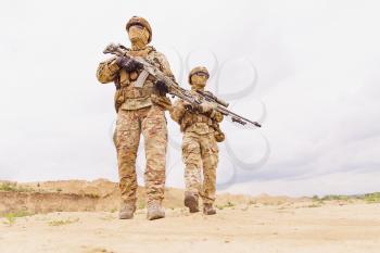 Equipped and armed special forces soldiers with rifles during army operation