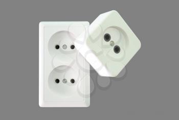 Two white electrical sockets are allocated on a grey background.
