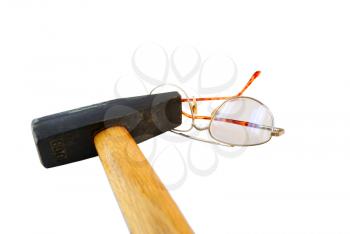 Heavy hammer and the broken glasses on a white background.