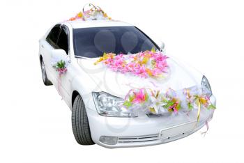 The white wedding car decorated with flowers on a white background.