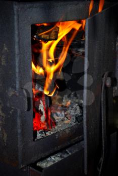 Burning fire wood in the brick furnace
