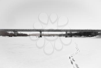 Concrete bridge over the frozen river