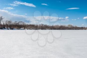 Winter landscape with frozen river