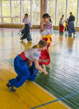 Lviv, Ukraine - April 25.2015: Competitors in the martial arts to perform in the gym in the city park in Lviv, Ukraine