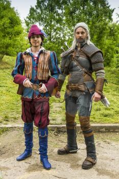 Lviv, Ukraine - May 23,2015: Men  dressed in the style of the Middle Ages performs on stage at the festival cosplay Anicon in Lviv May 23.2015