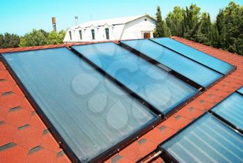 Solar water heating panels on the red roof. Gelio system