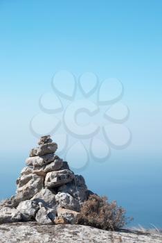 Stone tower - stack of zen stones on a blue sky background 