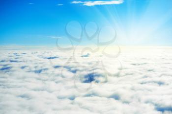 Blue sky and clouds. Plane view above the earth, can be used for background