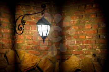 Old lamp on the red brick wall