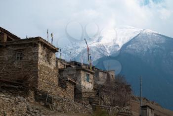 Tibetan village in Himalayan mountain with blue sky. 