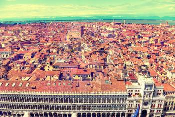 Venice roofs from above. Aerial view of houses, sea and palaces from San Marco tower. Instagram like filter