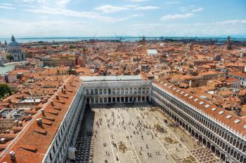 Air view to famous San Marco square in Venice, Italy. Piazza with many people