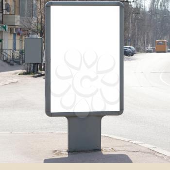 Vertical blank billboard on the city street
