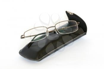 Spectacles and spectacle-case isolated on white.
