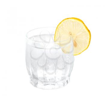 A cold water glass with lemon isolated on white.