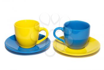 Two colored teacups isolated on white.