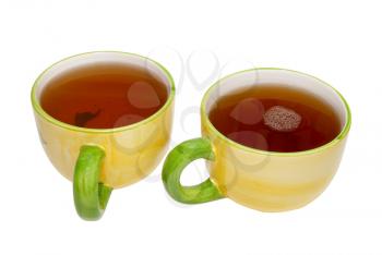 Two teacups with tea isolated on white.