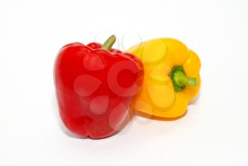 Red and yellow paprika isolated on white.