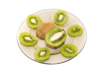 Fresh kiwi on the plate isolated on white.