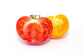 Two halves of fresh tomatoes isolated on white.