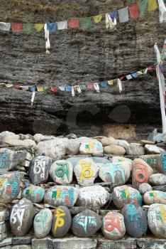 Tibetan colorful prayer stones with letters. Nepal.